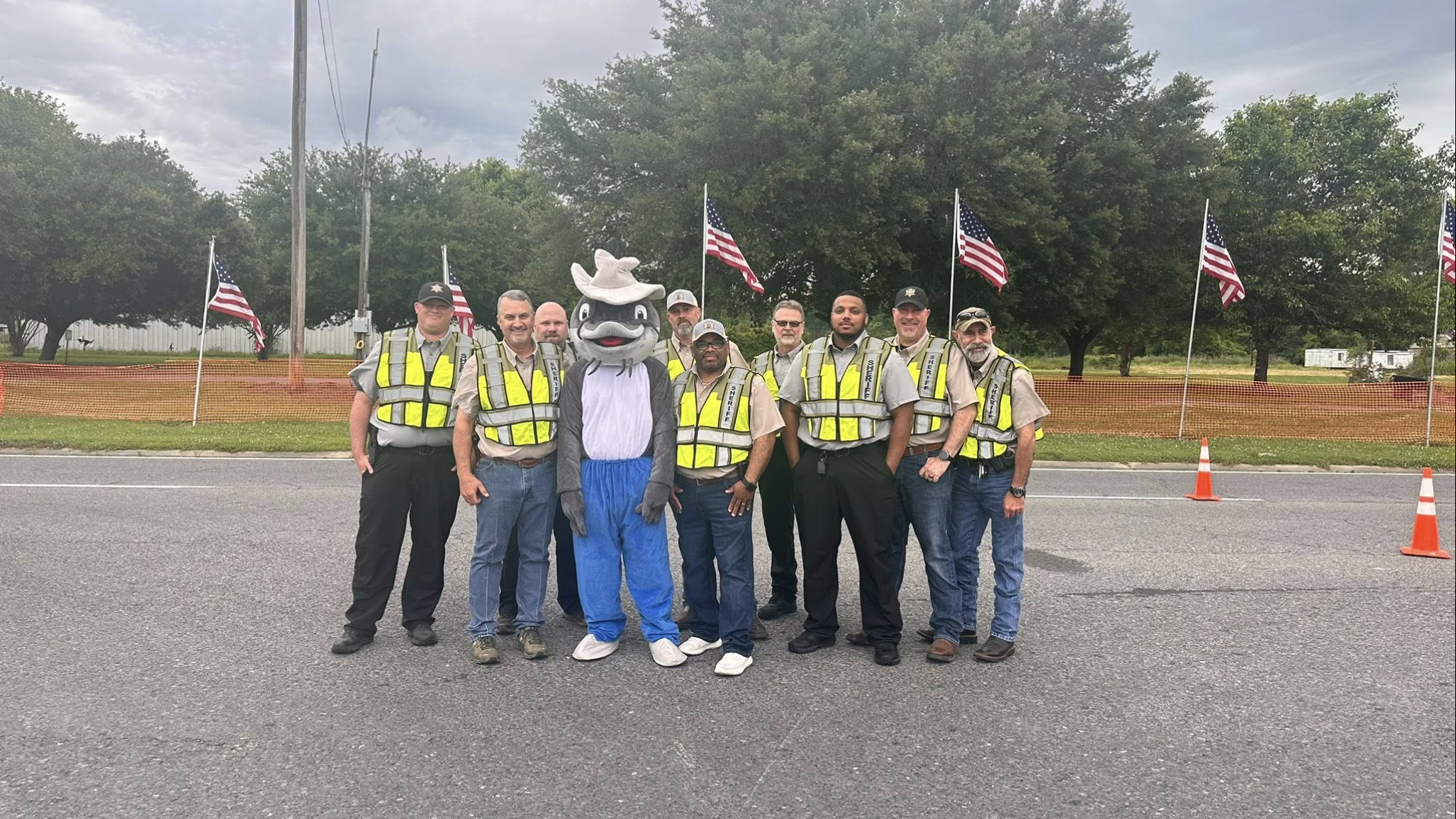 Security crew with the mascot and American flags